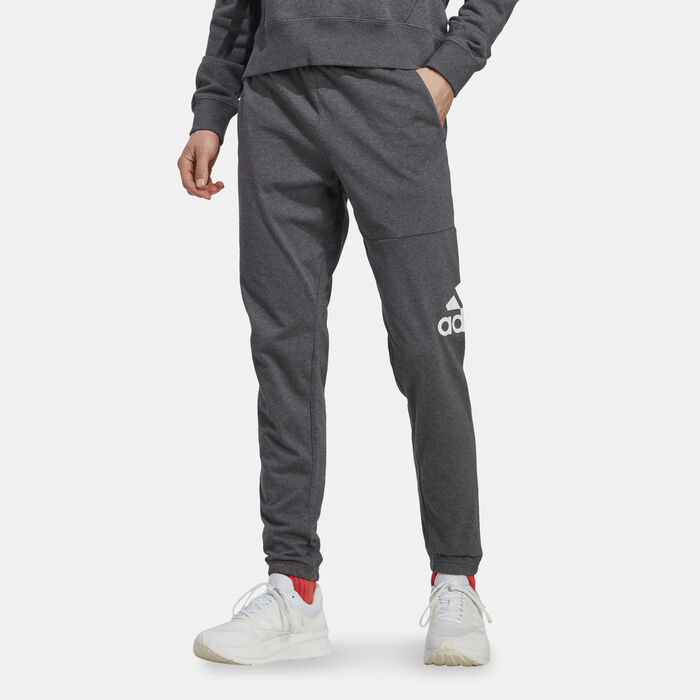 adidas Men's Essentials Badge of Sport Tapered Joggers Beige adidas Men's Essentials Badge of Sport Tapered Joggers Beige image number 0