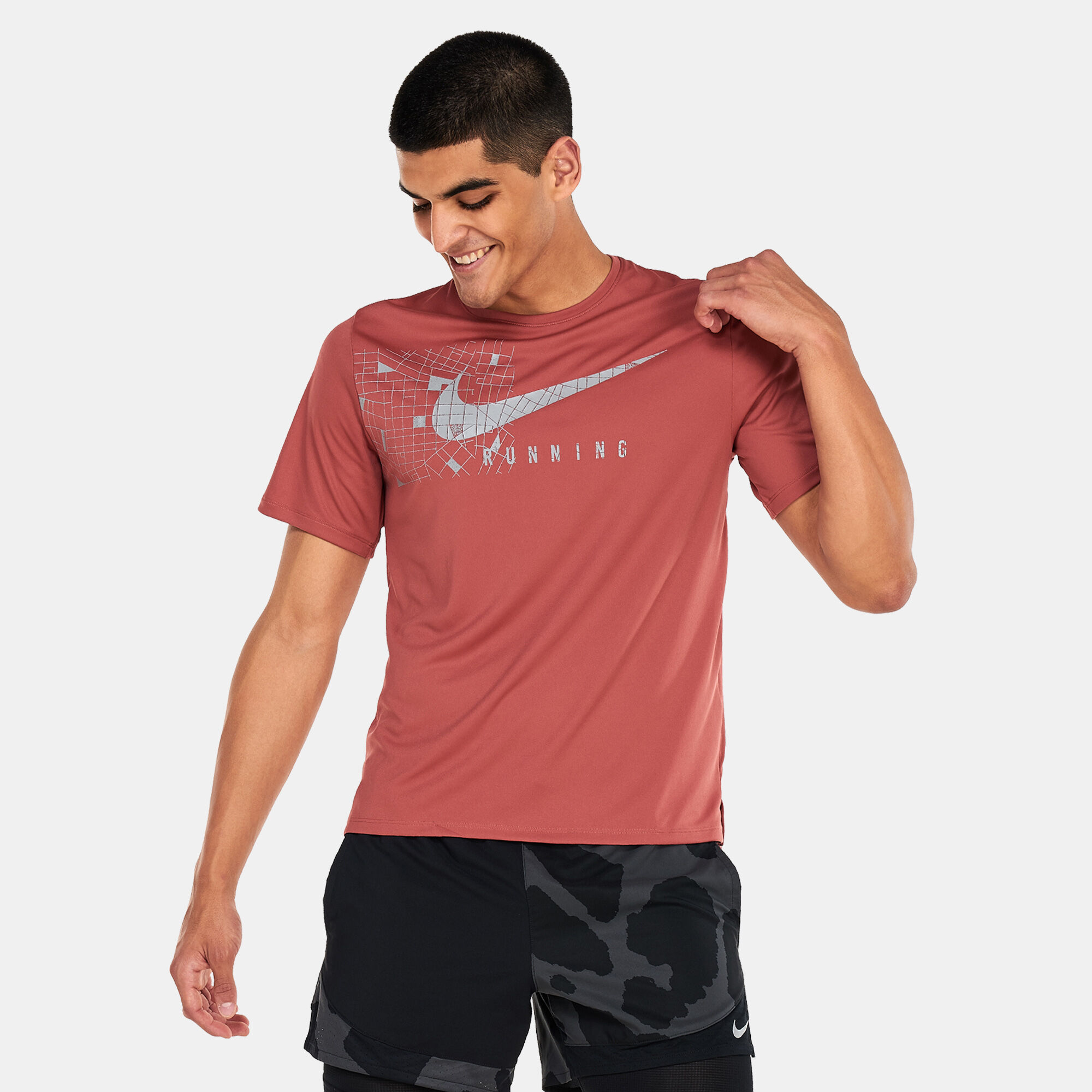 Men s Dri FIT UV Miler Run Division Graphic T Shirt Red Nike in Qatar SSS