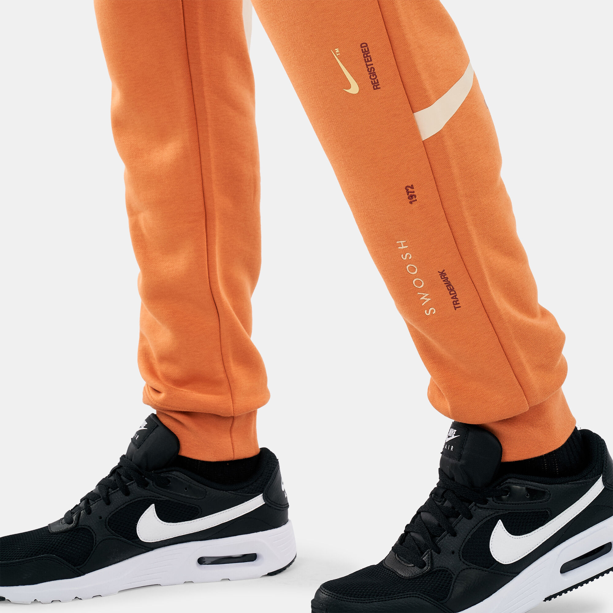 Nike double swoosh joggers orange 2025