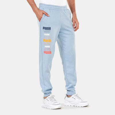 PUMA Men's Logo Repeat Graphic Sweatpants Blue