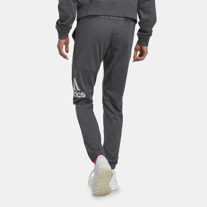 adidas Men's Essentials Badge of Sport Tapered Joggers Beige adidas Men's Essentials Badge of Sport Tapered Joggers Beige image number 1