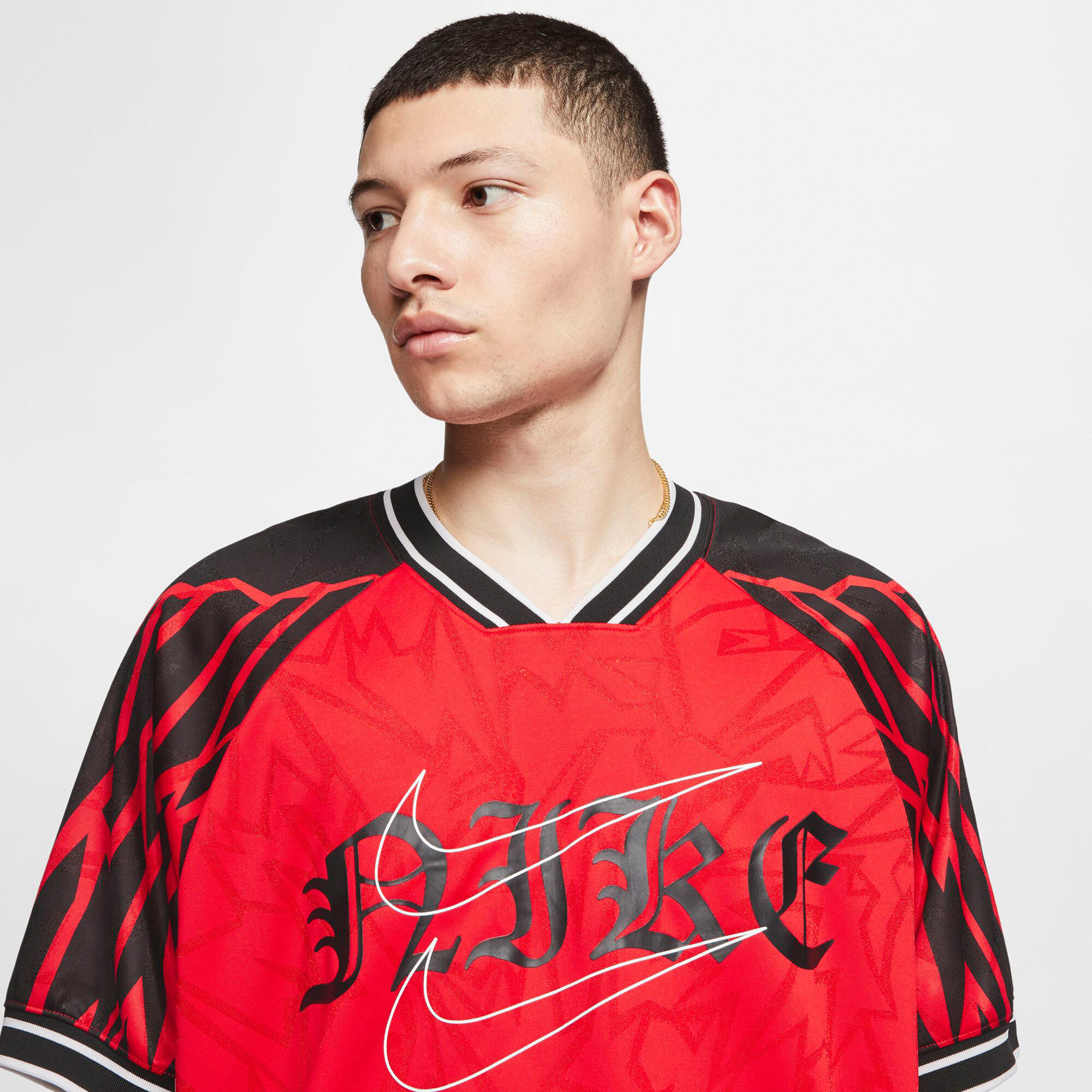 red black and yellow nike shirt