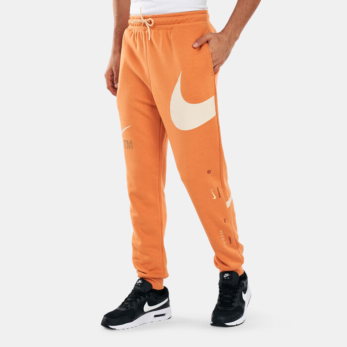 Nike Men's Sportswear Swoosh Semi-Brushed-Back Pants Orange Nike Men's Sportswear Swoosh Semi-Brushed-Back Pants Orange image number 0