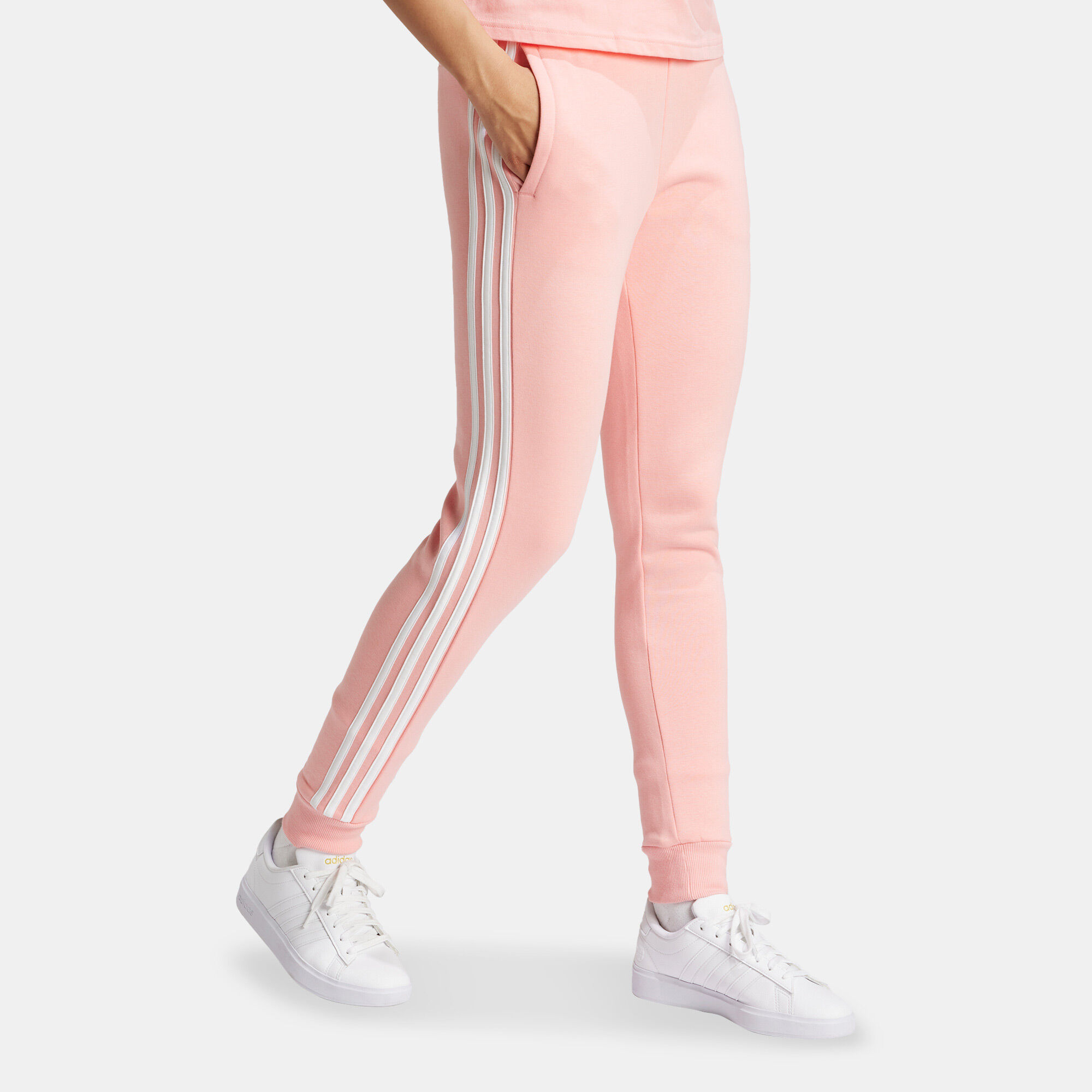 Women s Essentials 3 Stripes Fleece Pants Pink adidas in Qatar SSS