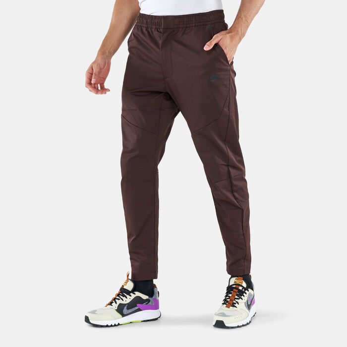 Nike Men's Sportswear Tech Essentials Unlined Commuter Pants Brown image number 0