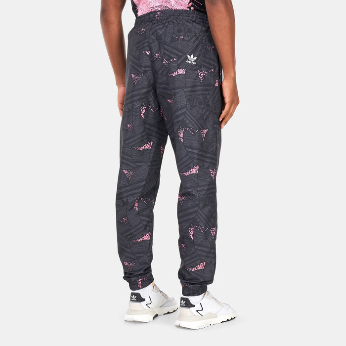 adidas Originals Men's Rekive Trefoil All Over Print Track Pants Black adidas Originals Men's Rekive Trefoil All Over Print Track Pants Black image number 1