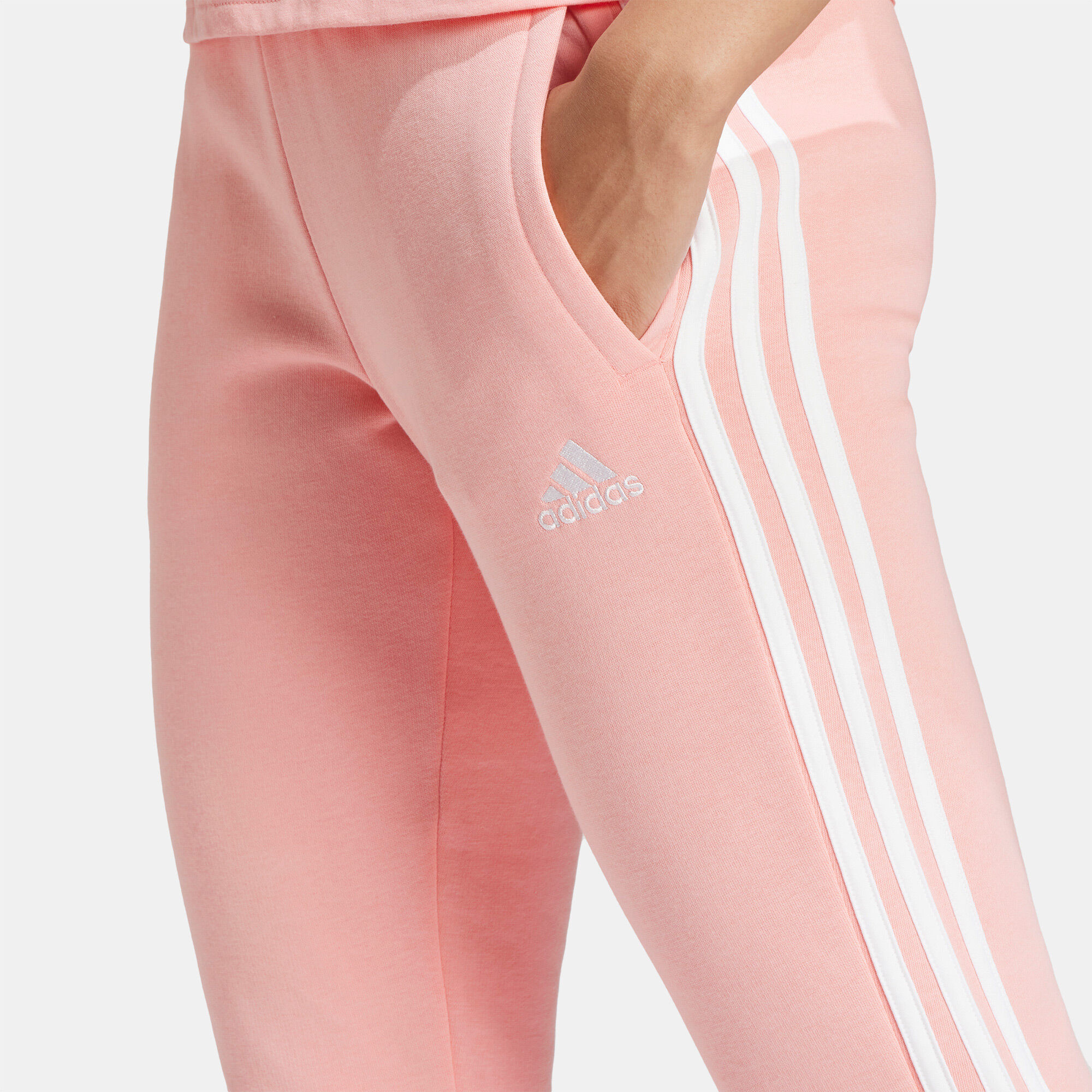 Women s Essentials 3 Stripes Fleece Pants Pink adidas in Qatar SSS