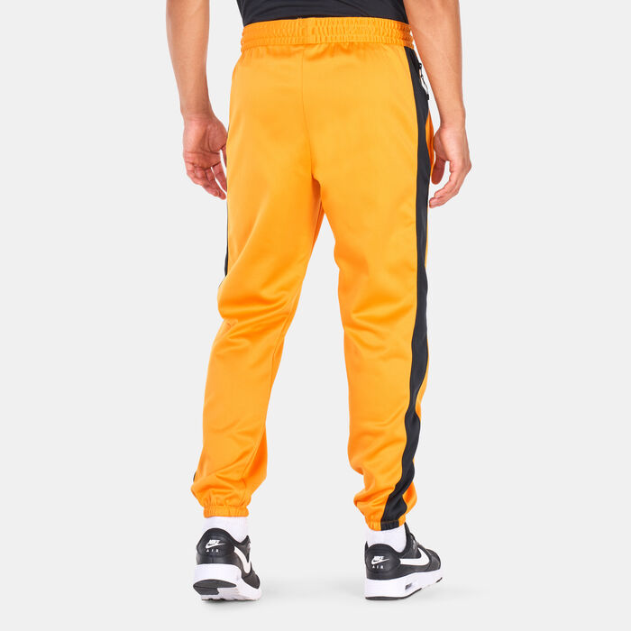 Nike Men's Therma-FIT Starting 5 Basketball Fleece Pants Orange image number 1