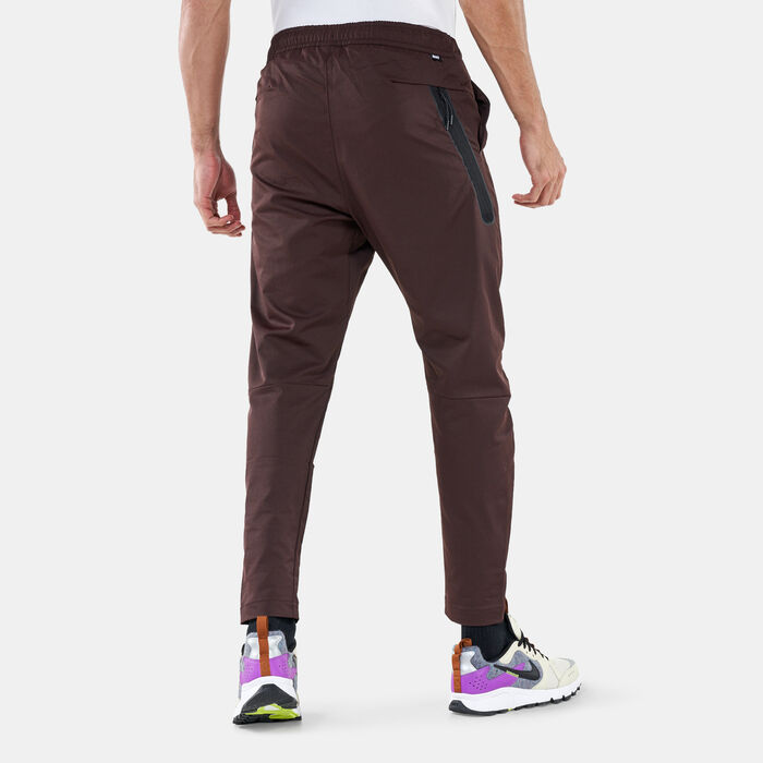 Nike Men's Sportswear Tech Essentials Unlined Commuter Pants Brown image number 1