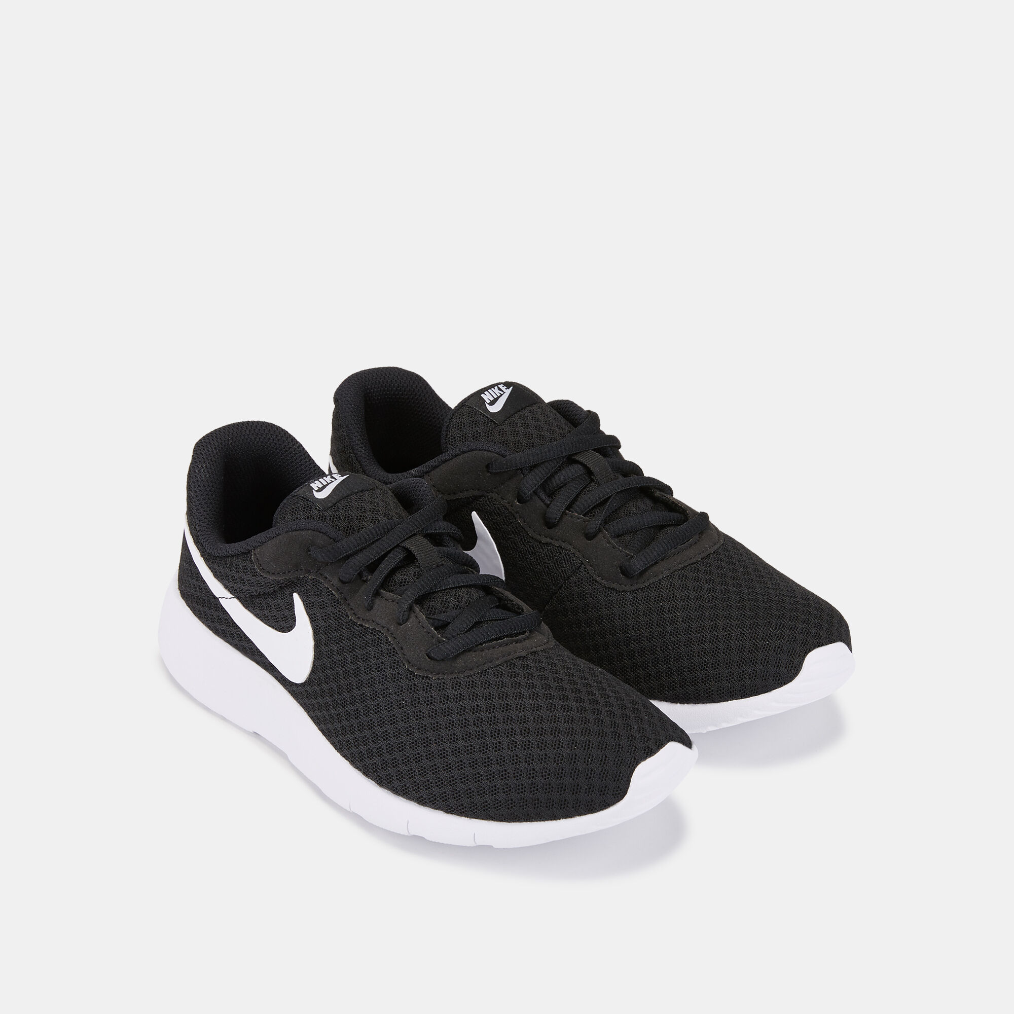 Kids Tanjun Shoe Older Kids Black Nike in Qatar SSS