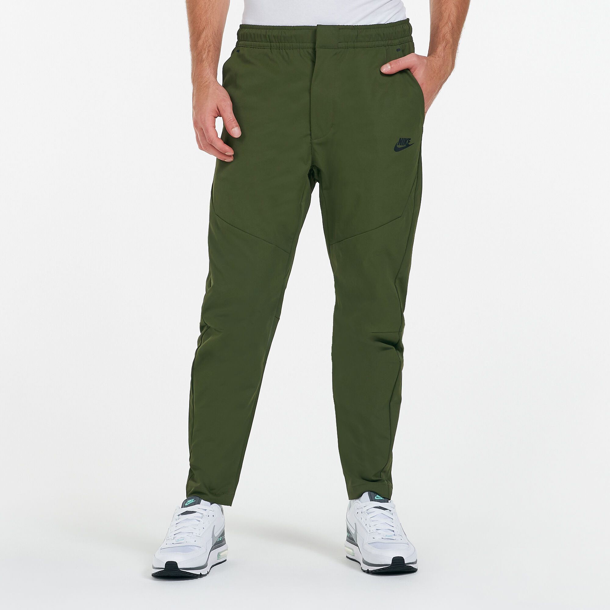 Men s Sportswear Tech Essentials Unlined Commuter Pants Green Nike in Qatar SSS